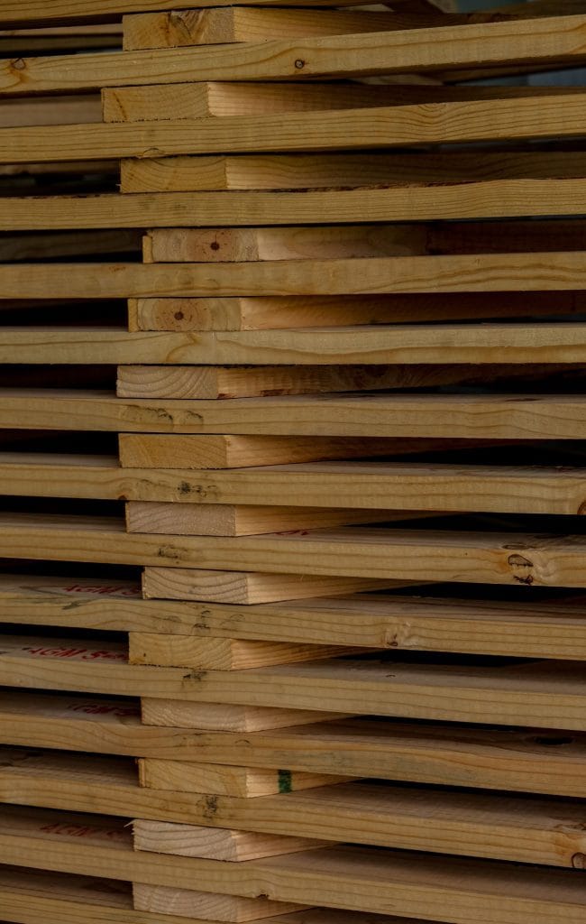 Wooden dunnage planks used for cargo support and transport protection